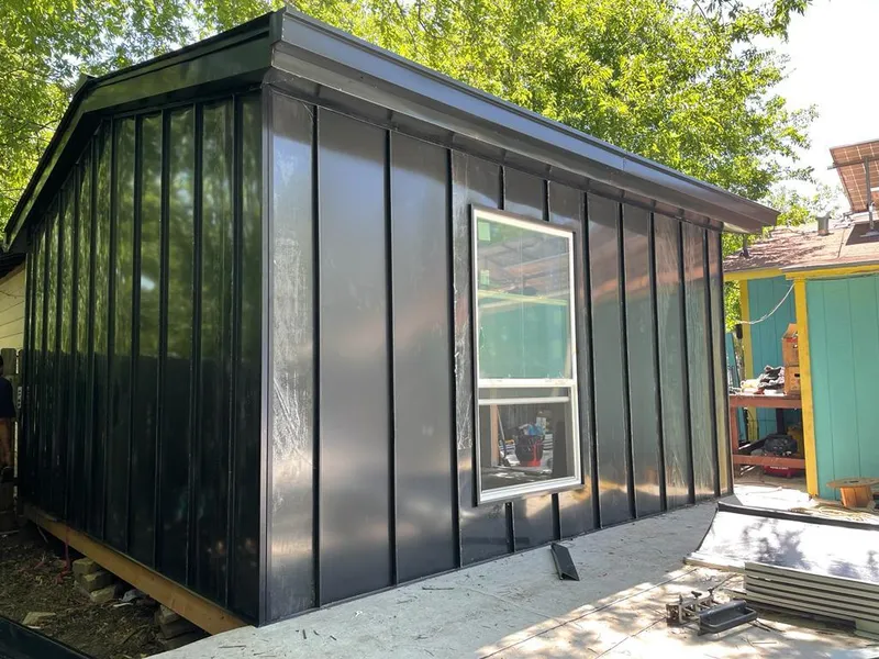 Black standing seam metal wall panels for Roof Inspection in Thompson