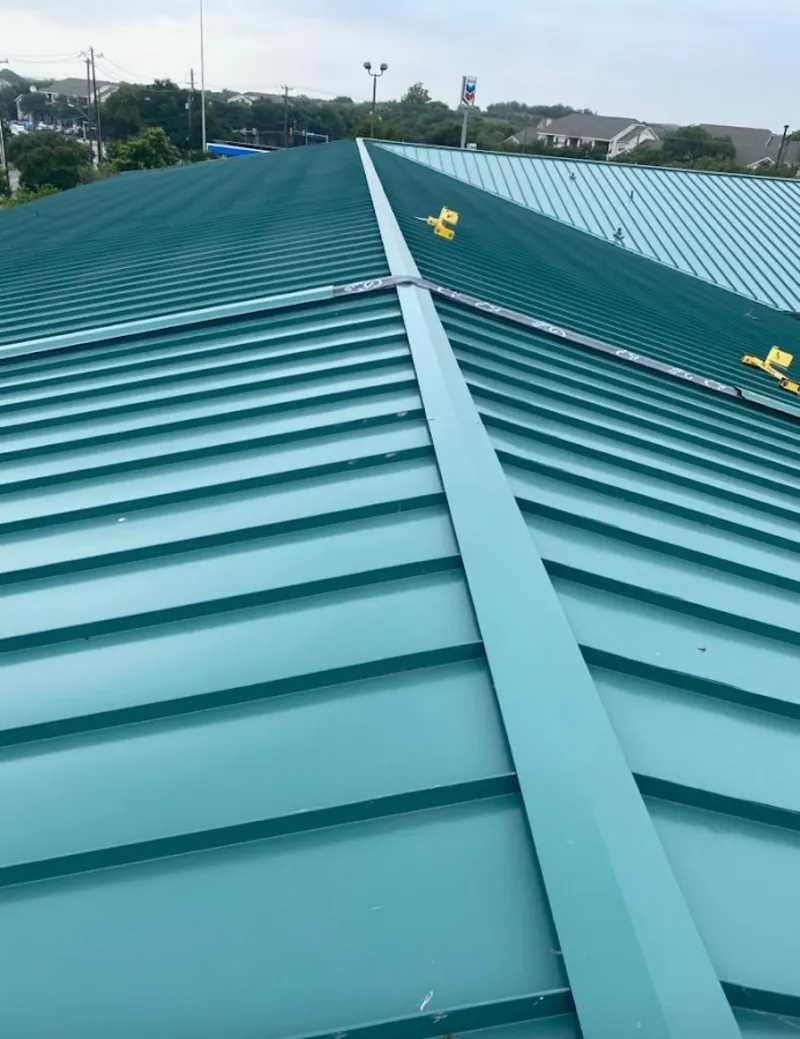 Green commercial metal roof ridge and valley for Metal Roof Repair in Thompson